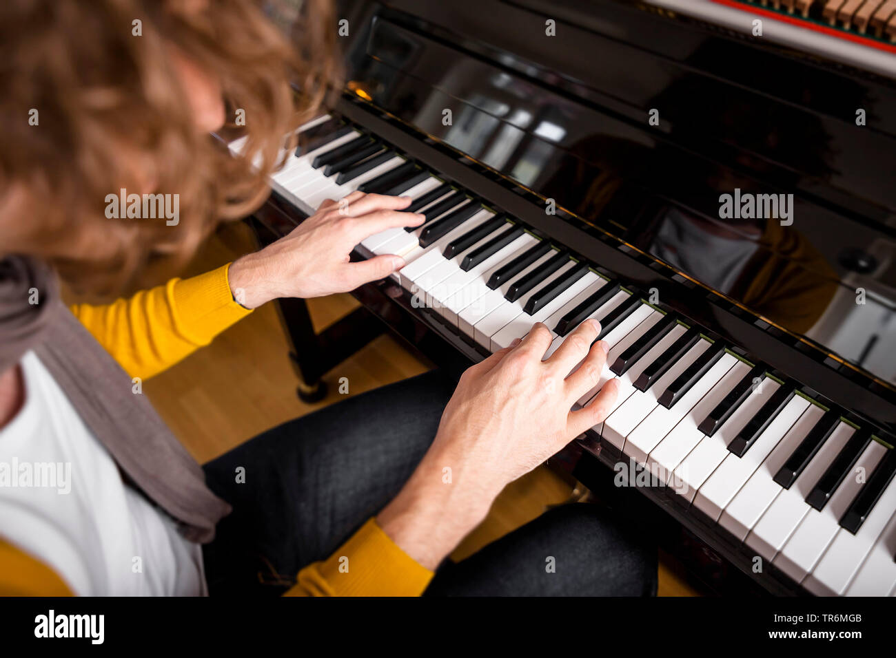 man playing piano, Germany Stock Photo
