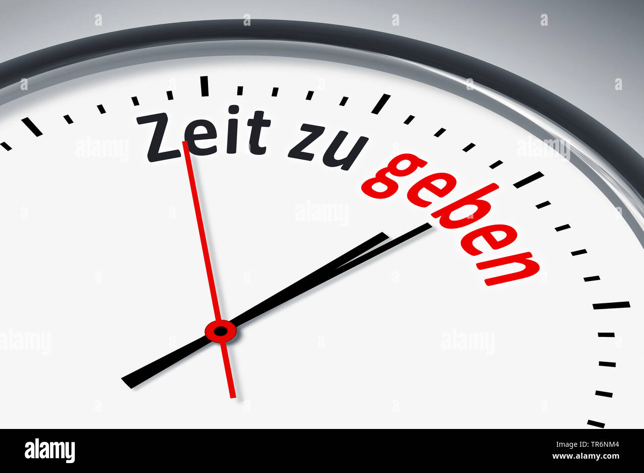 clock face with German inscription Zeit zu geben, time to give, Germany Stock Photo