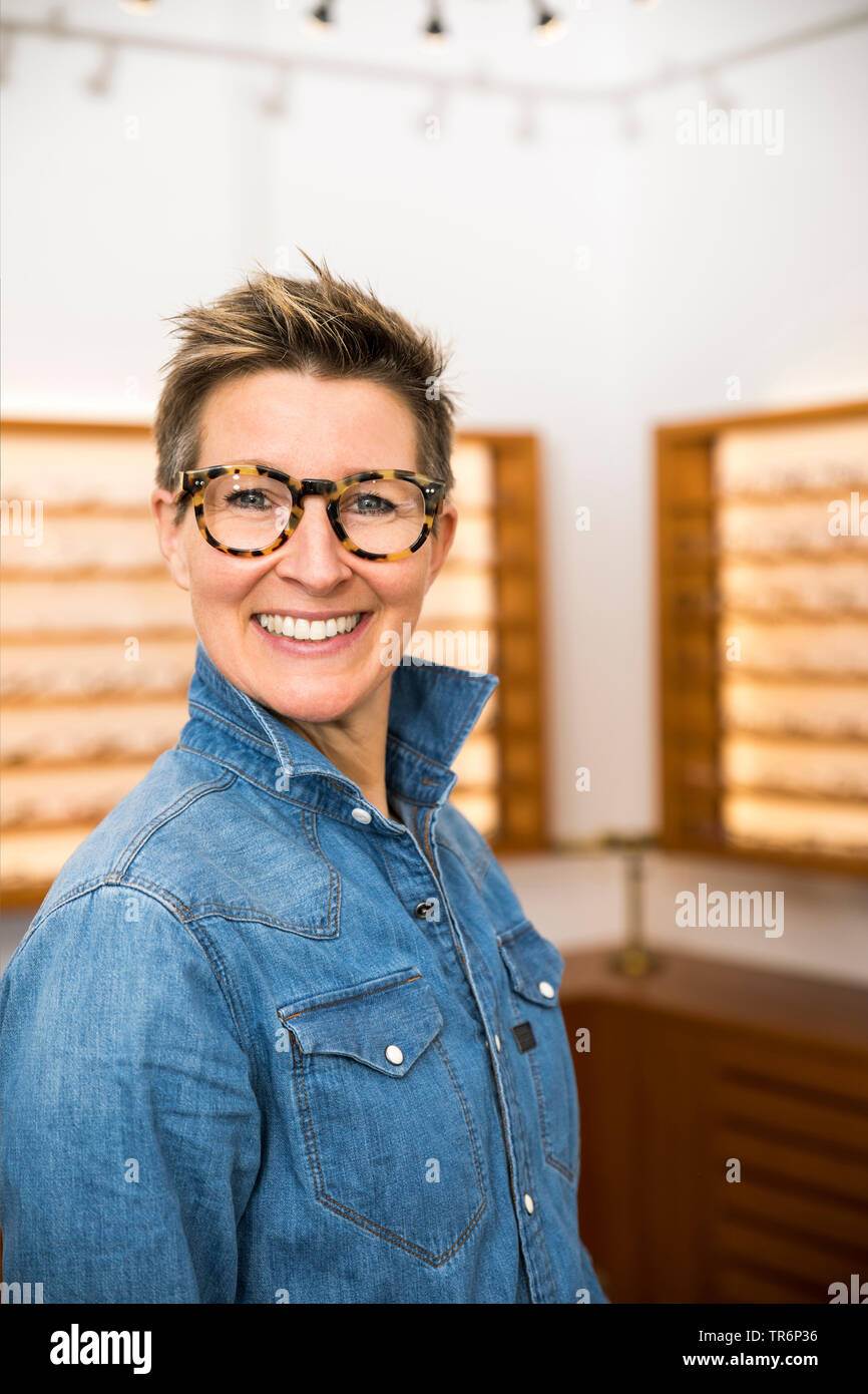 woman in a eyewear store, Germany Stock Photo