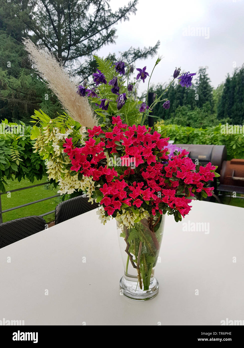 bouquet with on a desk on a garden terrace, Germany Stock Photo