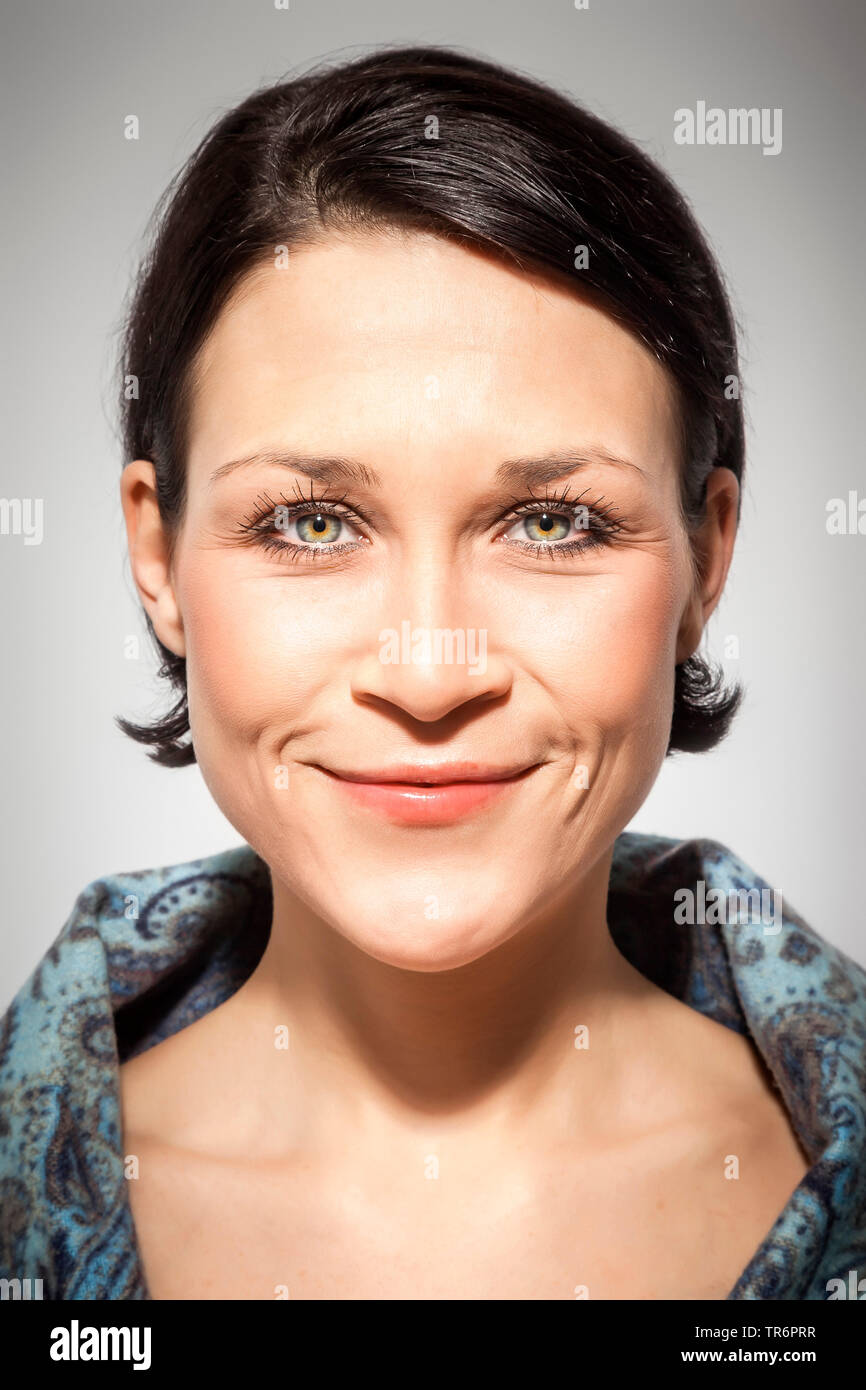 portrait of a young, good looking woman with black short hair Stock Photo