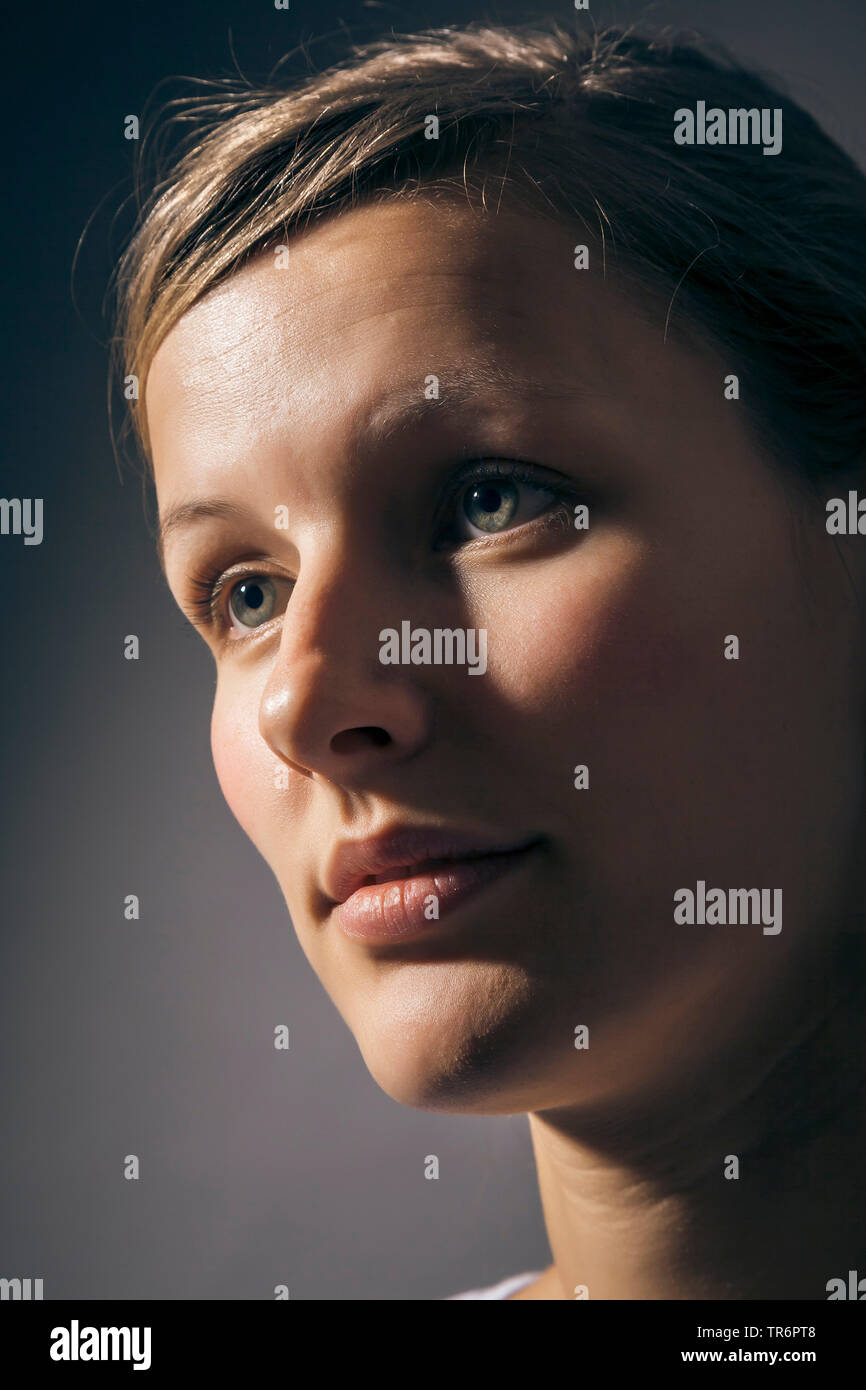 portrait of a good looking woman in partial shade, Germany Stock Photo