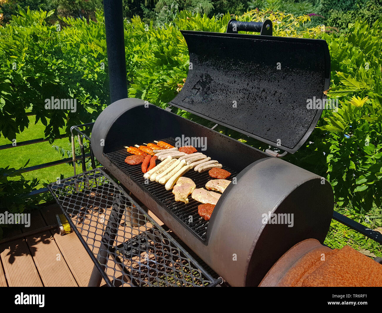 grill meat in a Barbecue-Smoker on a terrace, Germany Stock Photo - Alamy