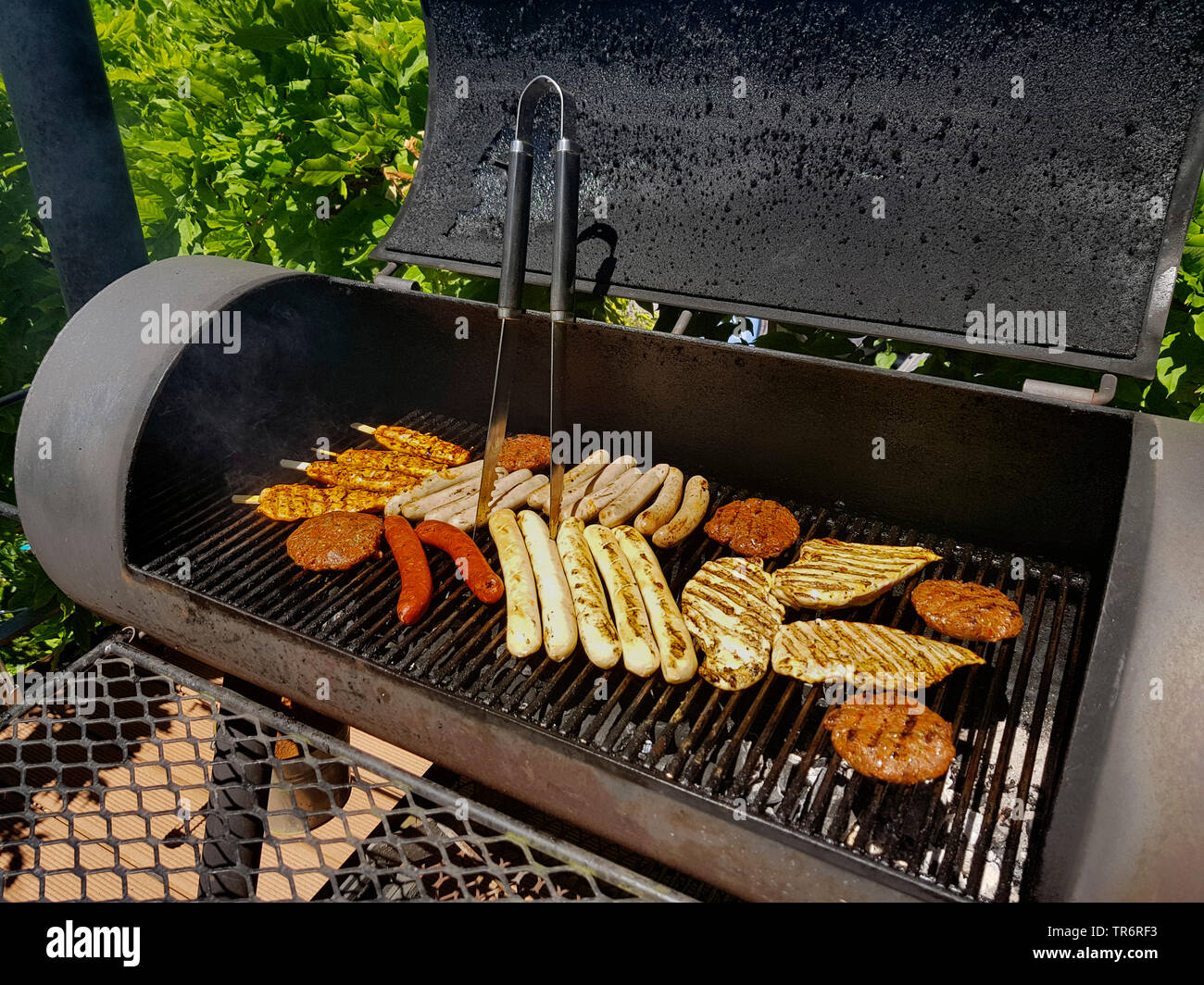 Large Barbecue Smoker Grill At The Park Meat Prepared In Barbecue Smoker  Stock Photo - Download Image Now - iStock
