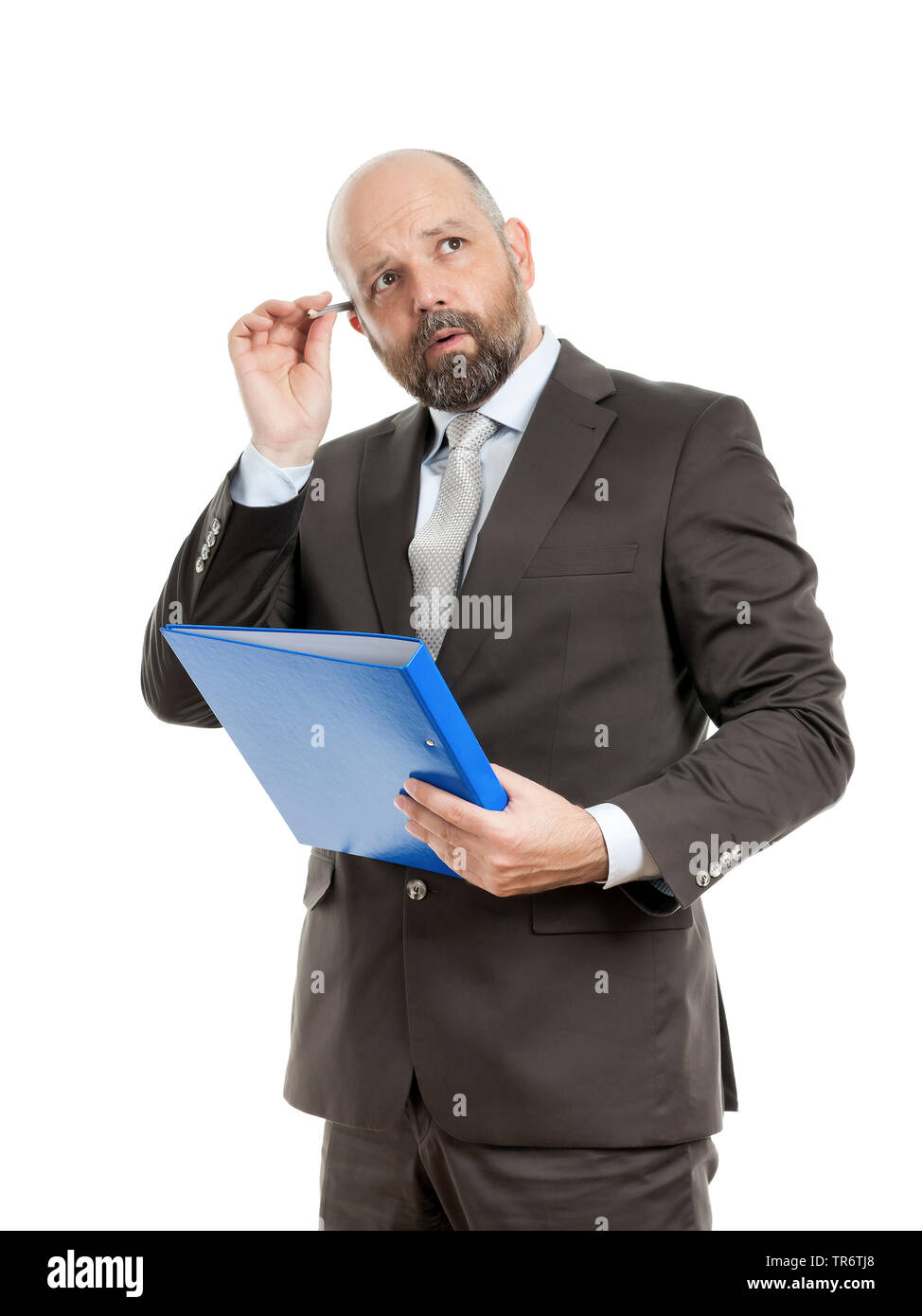 Middle-aged businessmann thinking about solutions and holding folder, Germany Stock Photo