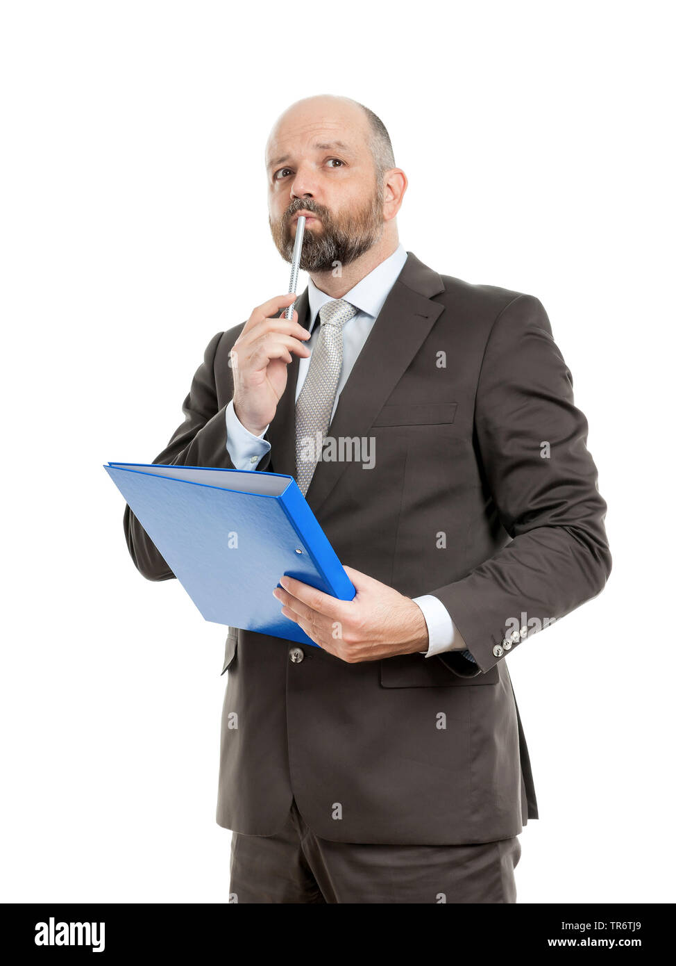 Middle-aged businessmann thinking about solutions and holding folder, Germany Stock Photo