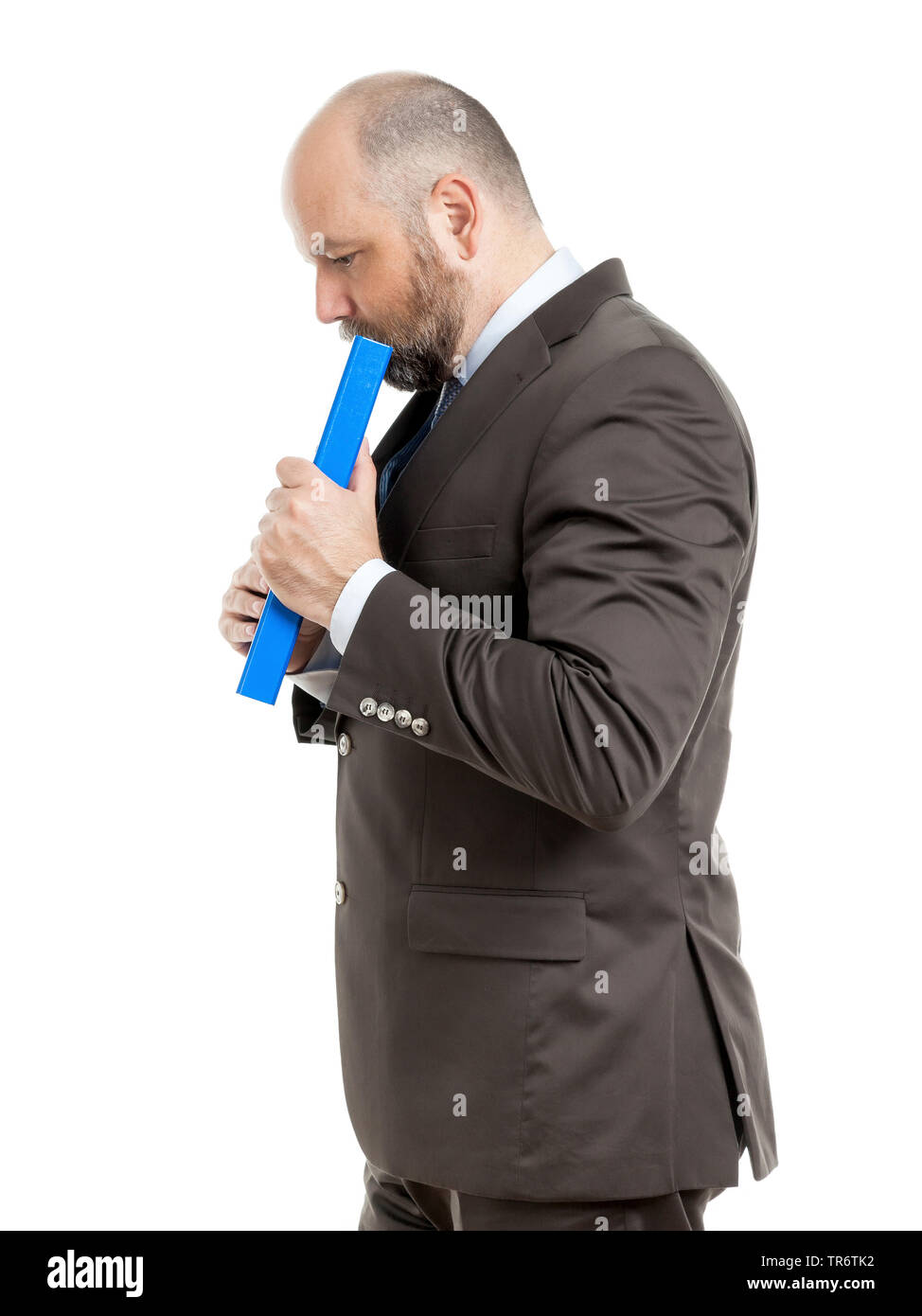 Middle-aged businessmann thinking about solutions and holding folder, Germany Stock Photo