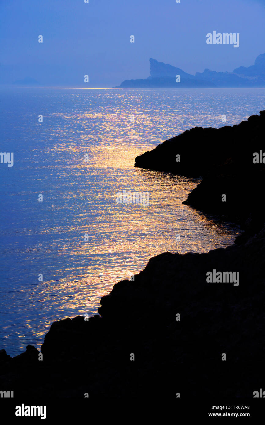 rocky coast of Calanques with Bec de l'Aigle in background in the evening, France, Provence Stock Photo