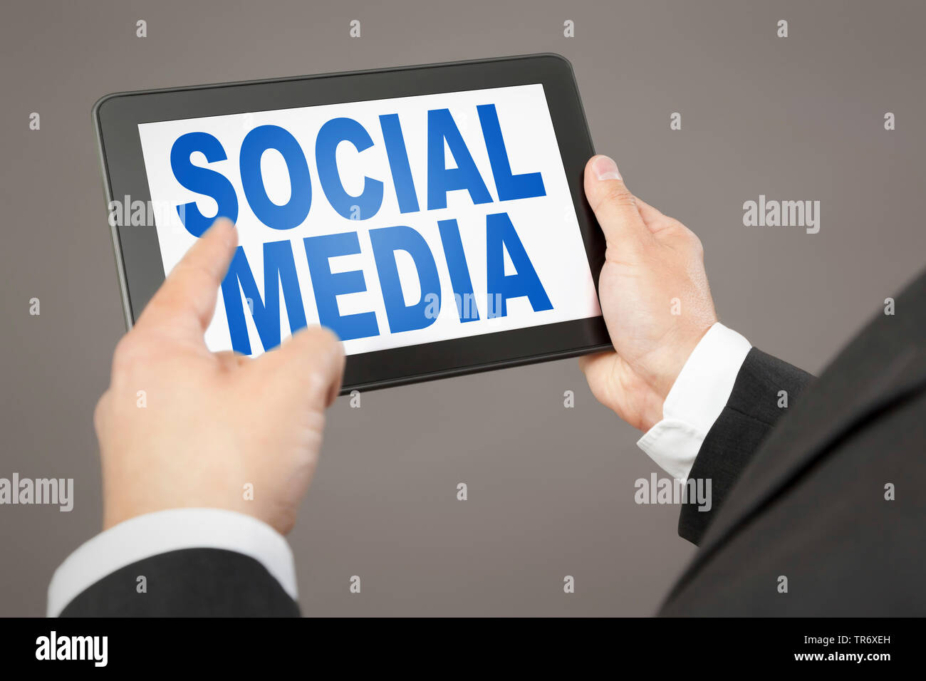 3D computer graphic, symbolised tablet computer reading SOCIAL MEDIA Stock Photo