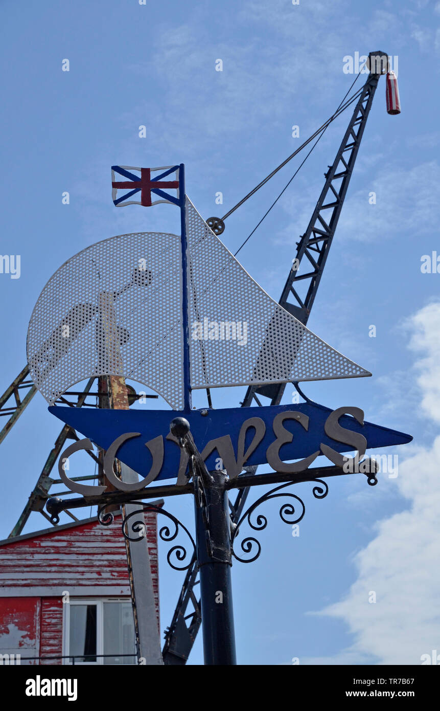 The town sign at Cowes on the Isle of Wight, with a restored dock crane behind. Stock Photo