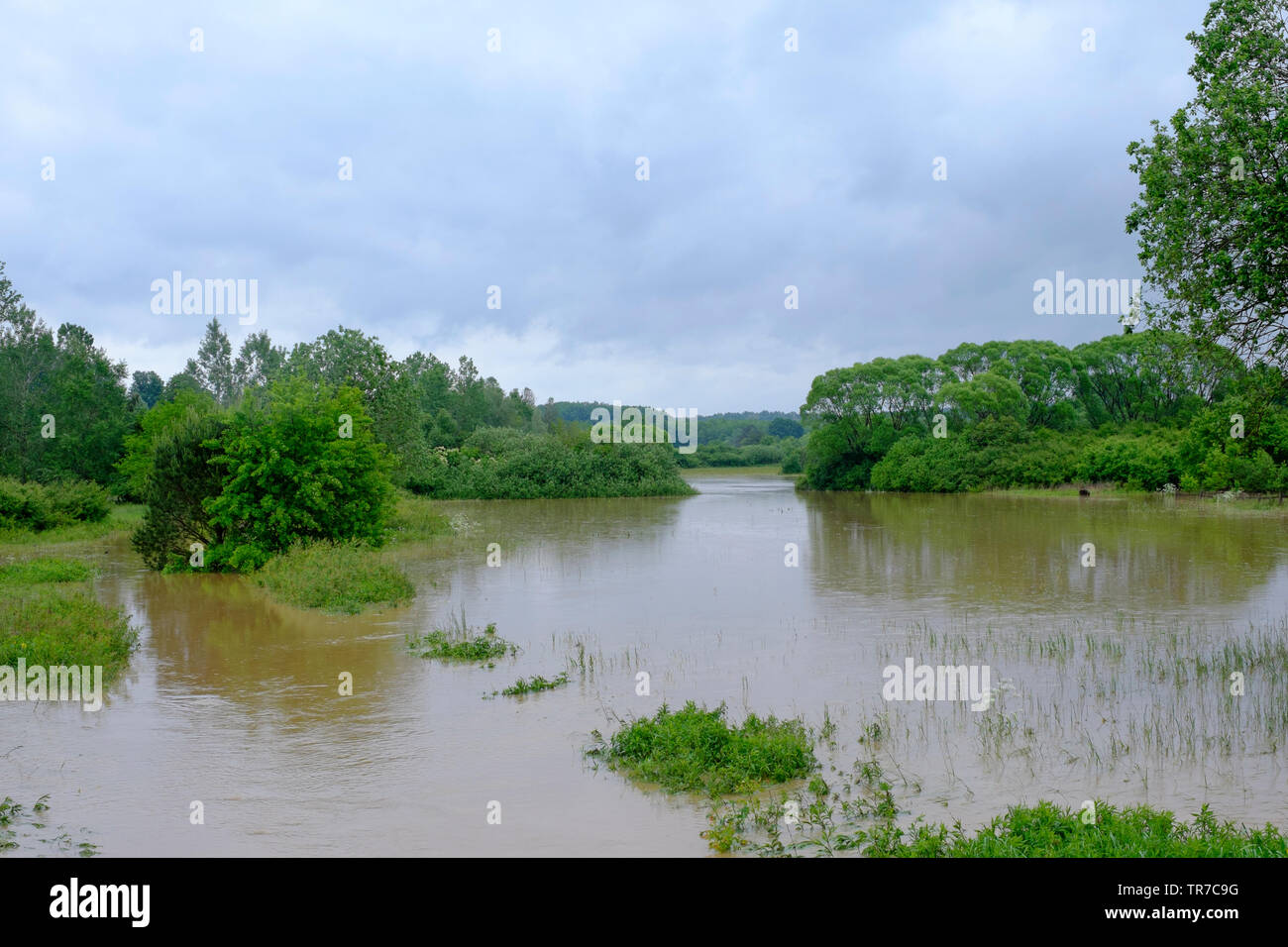 small river overflows after a period of prolonged heavy rain flooding the surrounding fields and meadows zala county hungary Stock Photo