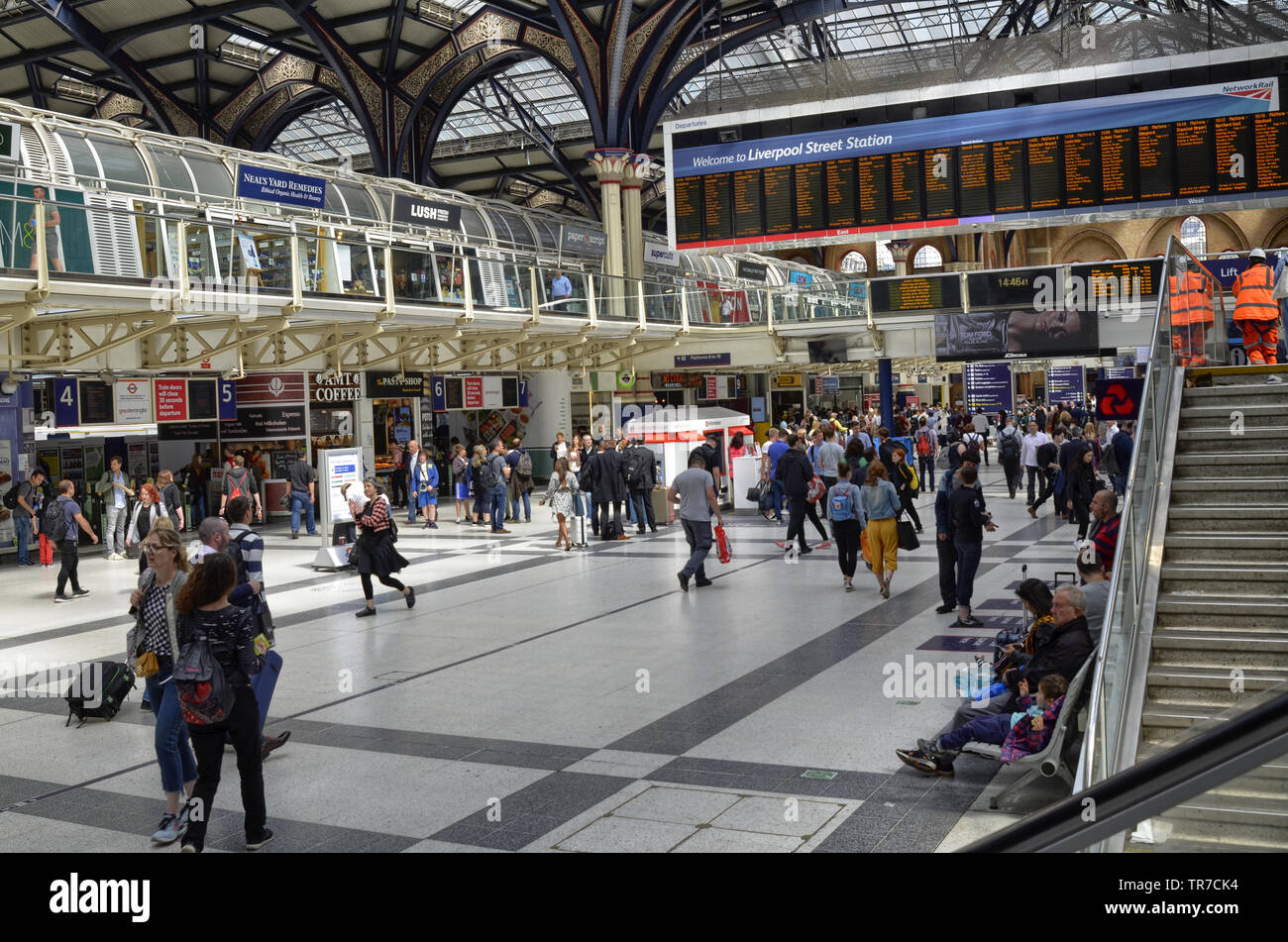 Liverpool street station, London United Kingdom, 14 June 2018. The main hall of the station, buzzing with people, the informative luminous display boa Stock Photo