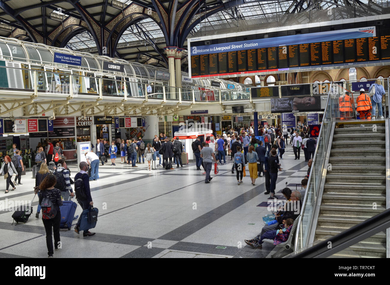 Liverpool street station, London United Kingdom, 14 June 2018. The main hall of the station, buzzing with people, the informative luminous display boa Stock Photo
