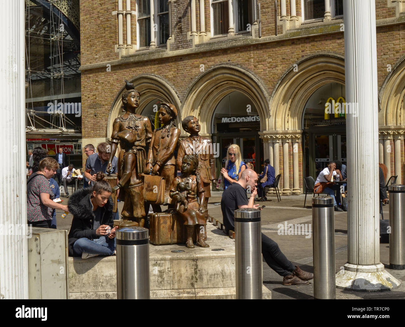 Liverpool street station, London United Kingdom, 14 June 2018. Arriving at the entrance we find a modern polished bronze statue of a collection of fiv Stock Photo