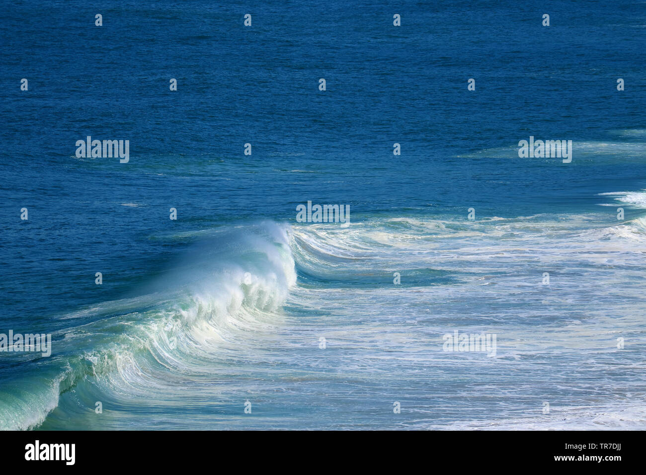 Splashing waves on the vivid blue sea Stock Photo - Alamy