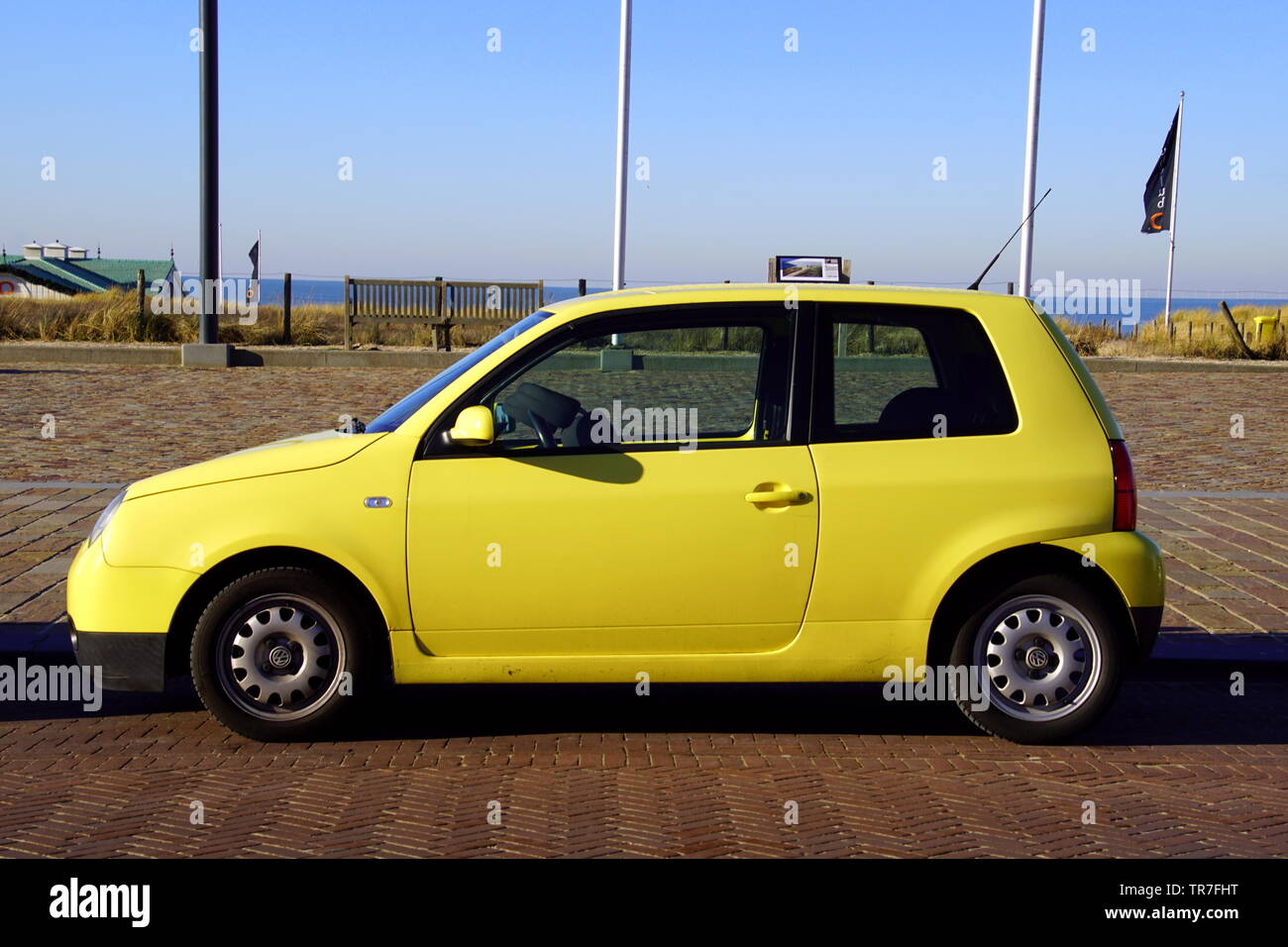 Noordwijk, the Netherlands - Januari 20, 2019: Yellow Volkswagen Lupo parked by the side of the road. Nobody in the vehicle. Stock Photo