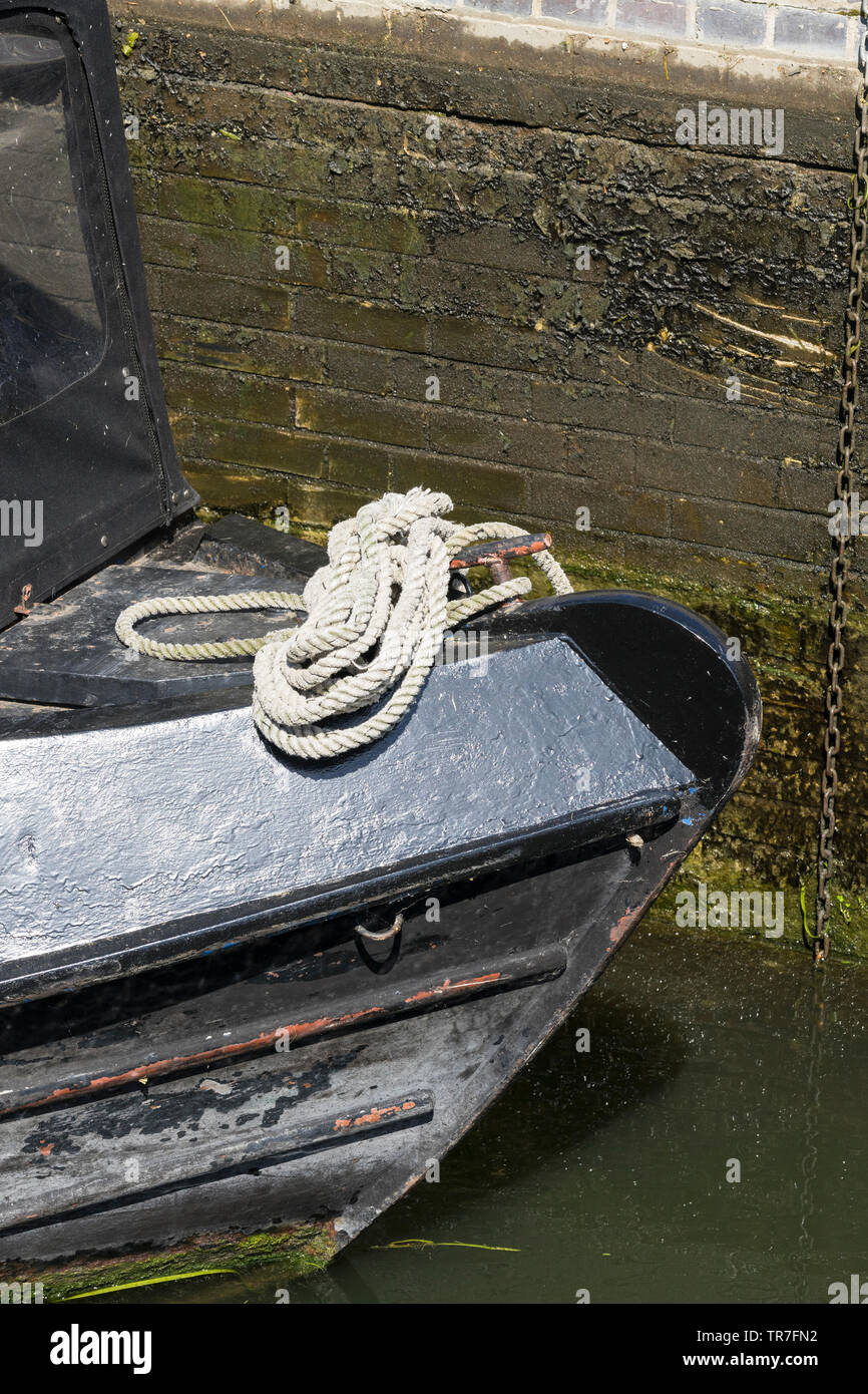 Coiled rope on bow of narrow boat Baits Bite lock Milton 2019 Stock Photo