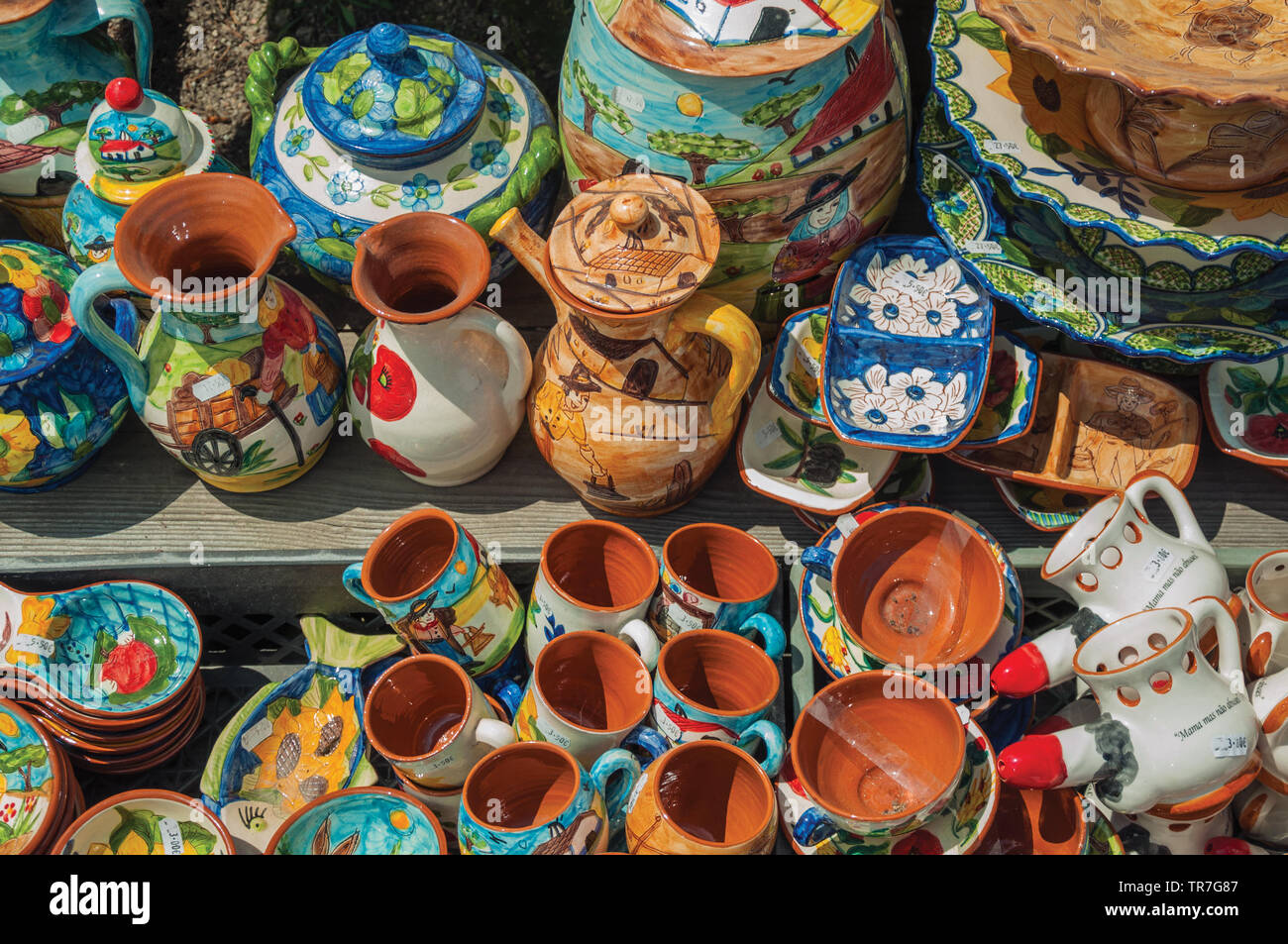 Colorful handmade porcelain pots and dishes, typical of the region ...