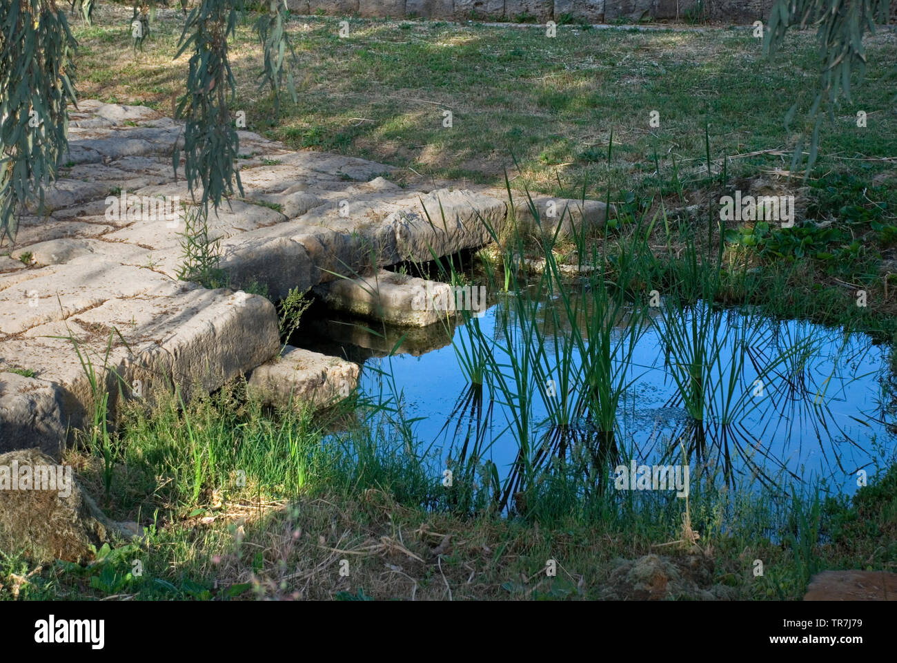 Ancient stone bridge at the ancient temple of goddess Artemis at Vravrona region in Attica, Greece, June 2018. Stock Photo