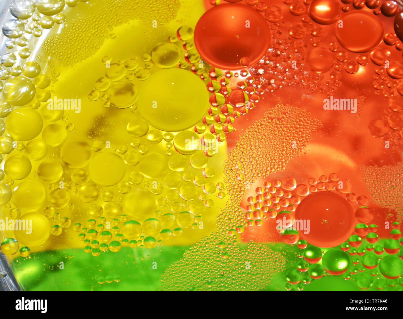 oil bubble floating on water surface in colorful background Stock Photo