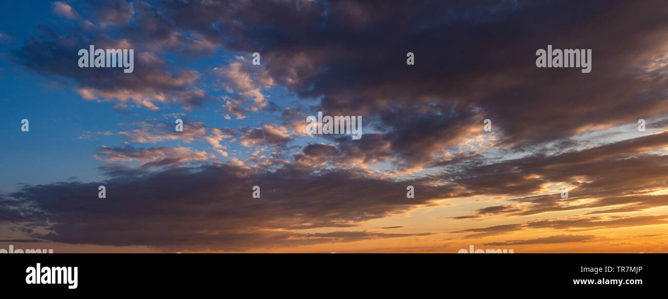 Sunset sky with clouds. Panorama Stock Photo - Alamy