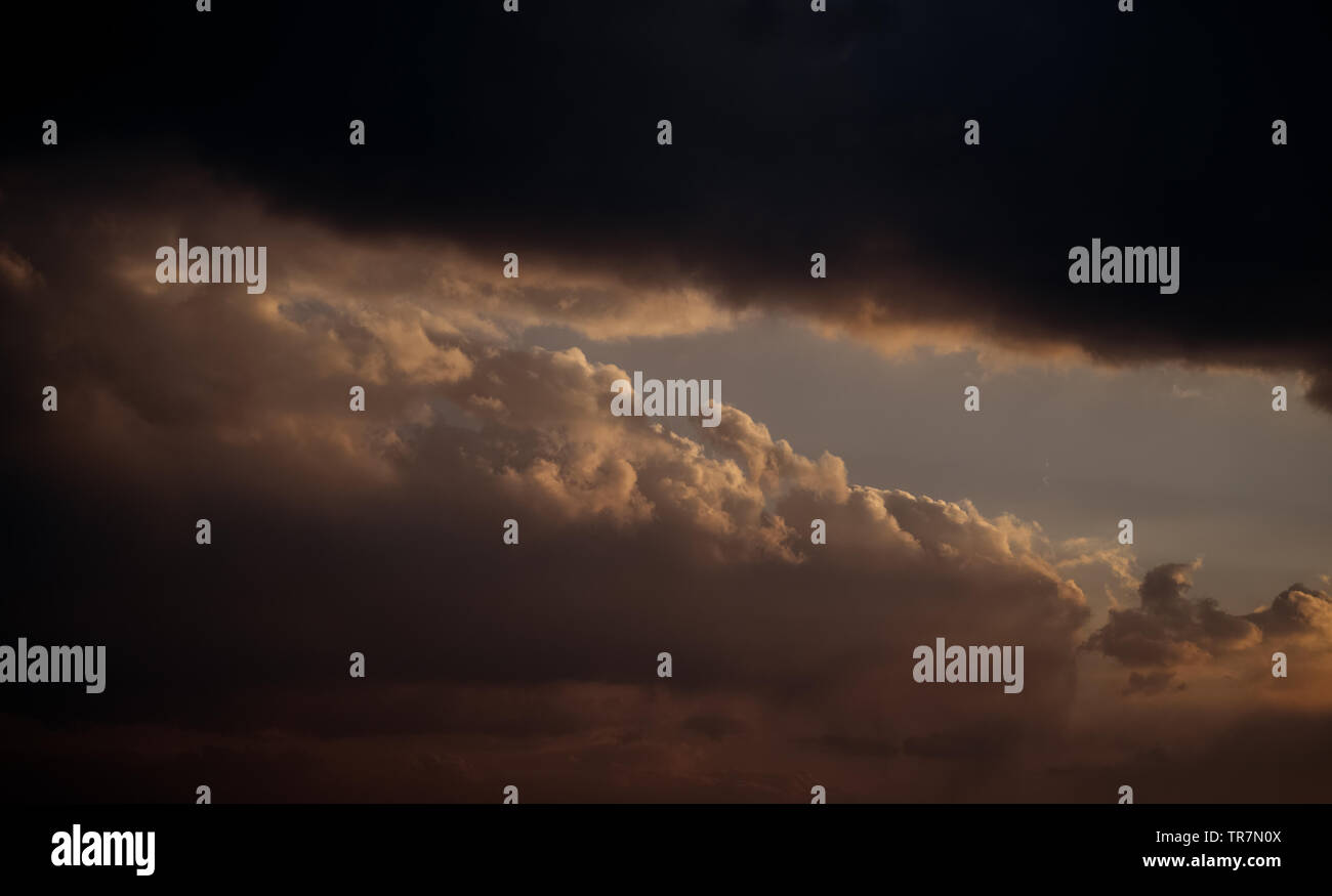 Dramatic sunset sky with orange clouds Stock Photo - Alamy