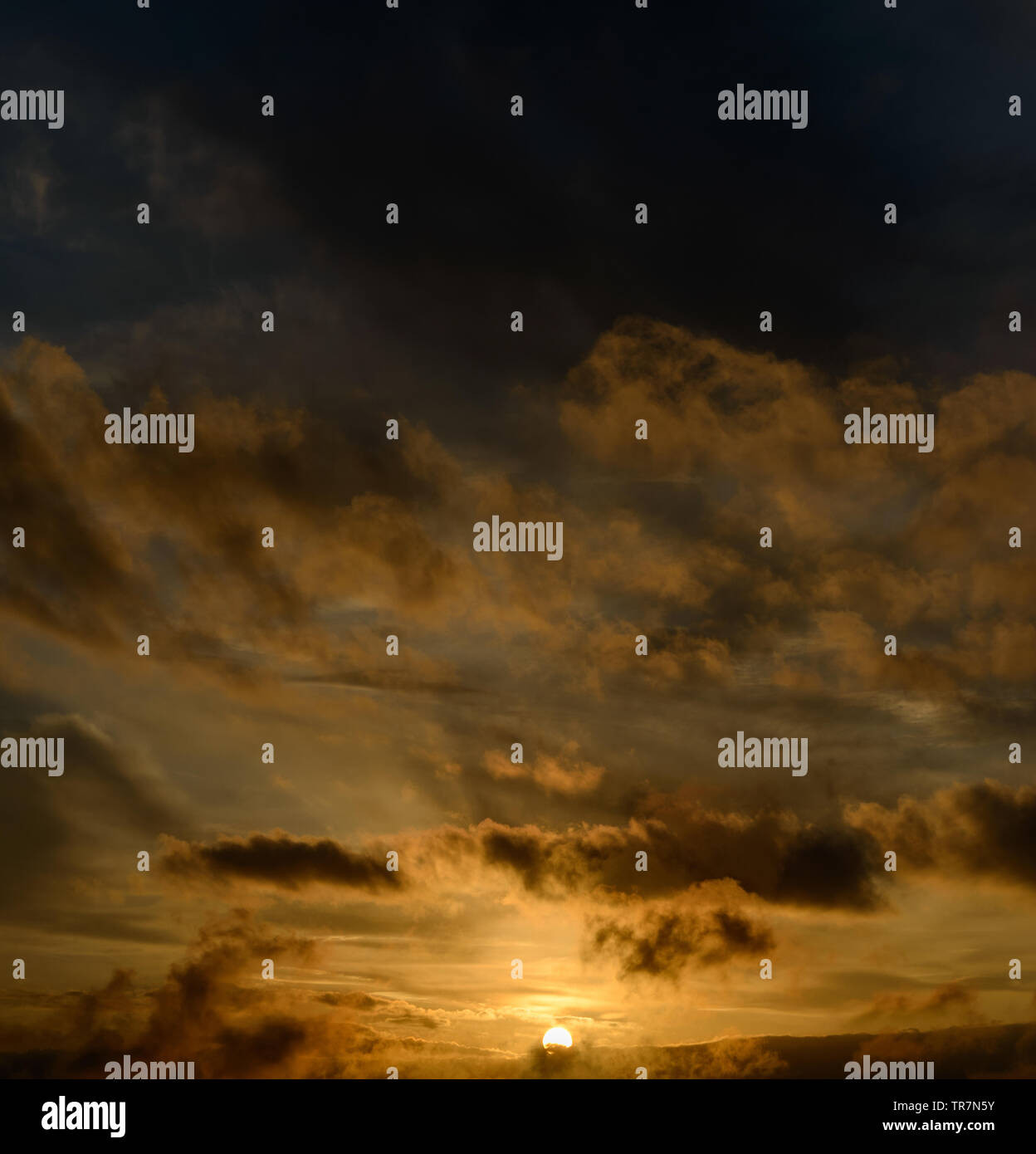 Dramatic sunset sky with dark clouds Stock Photo - Alamy