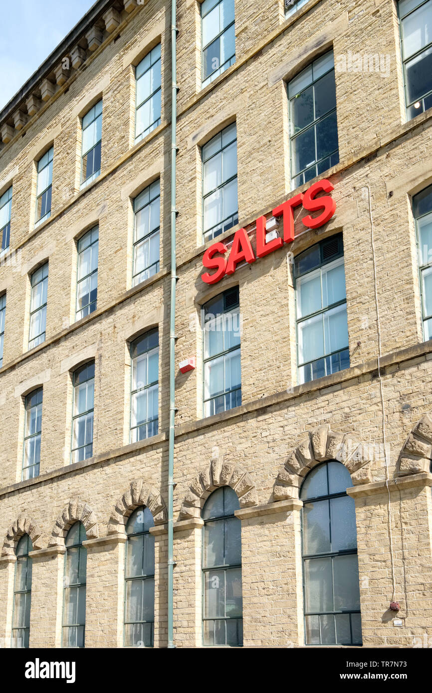 The facade of the former Salts Mill a former textile mill in the village of Saltaire, Yorkshire, UK Stock Photo