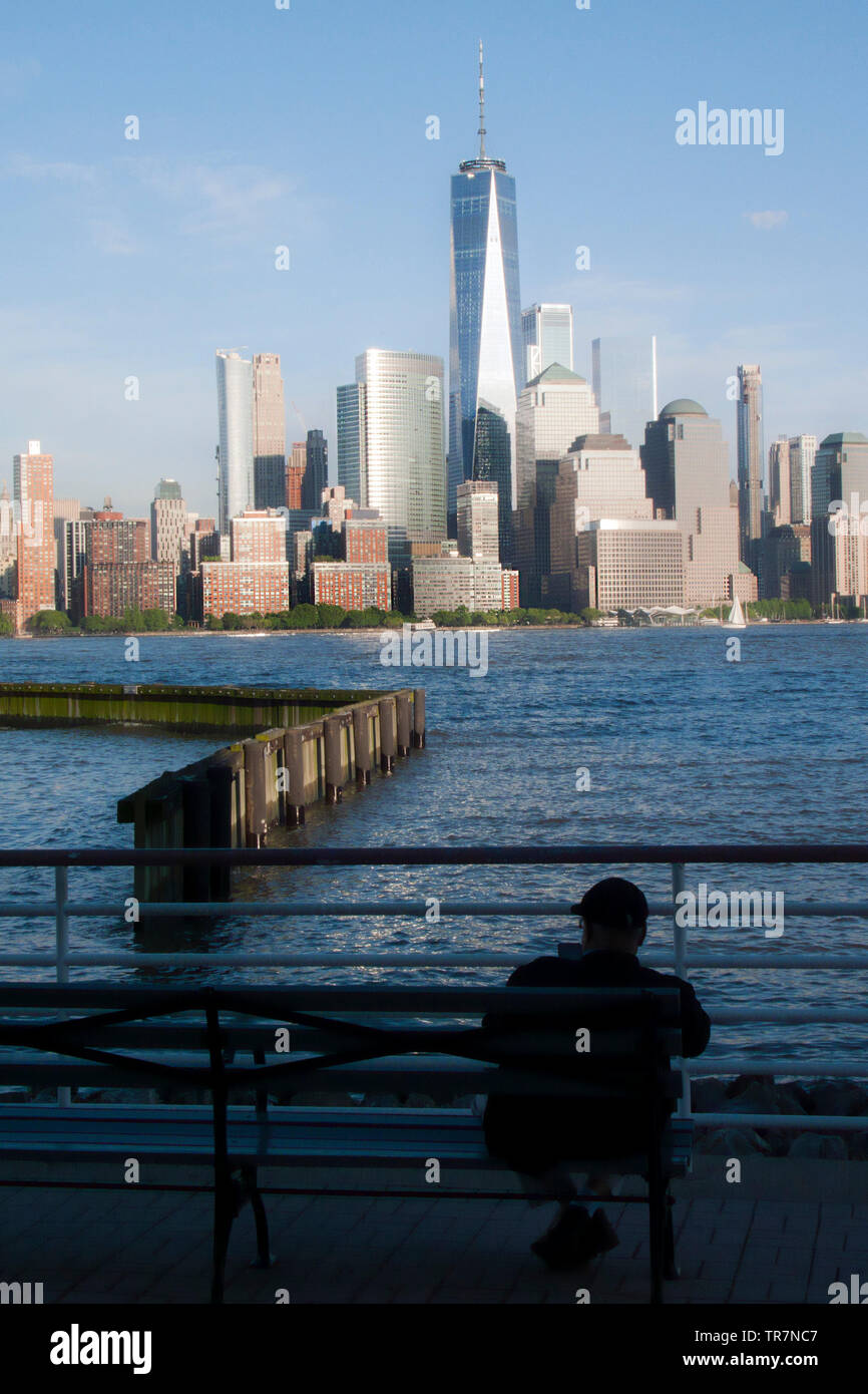 Solitary Man On Park Bench Viewing The One World Trade Centre And
