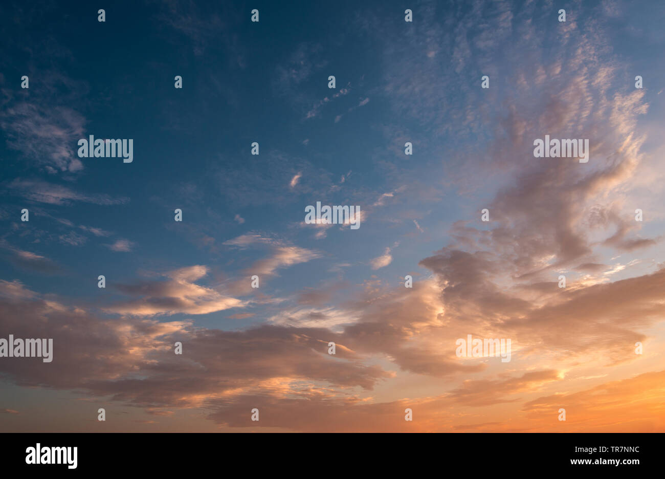 Dramatic sunset sky with orange colored clouds Stock Photo - Alamy
