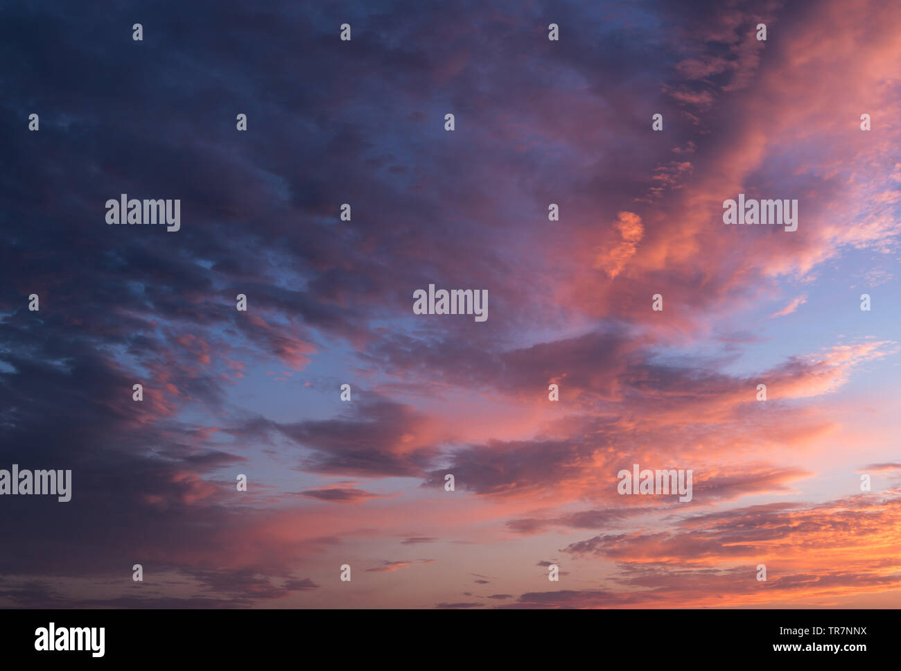 Dramatic sunset sky with orange colored clouds Stock Photo - Alamy