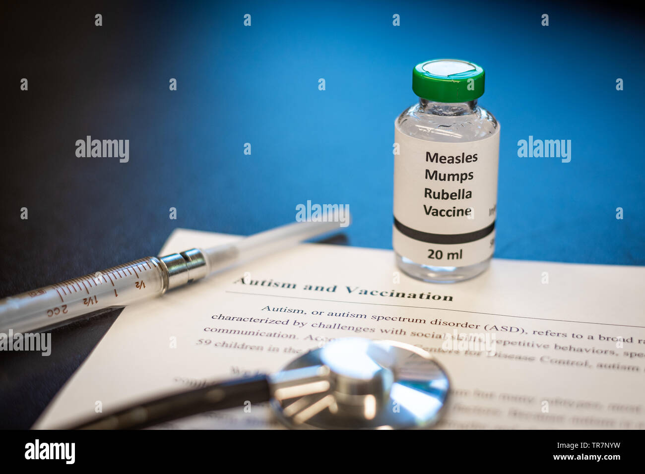 MMR measles vaccine with vaccination and autism information page Stock Photo