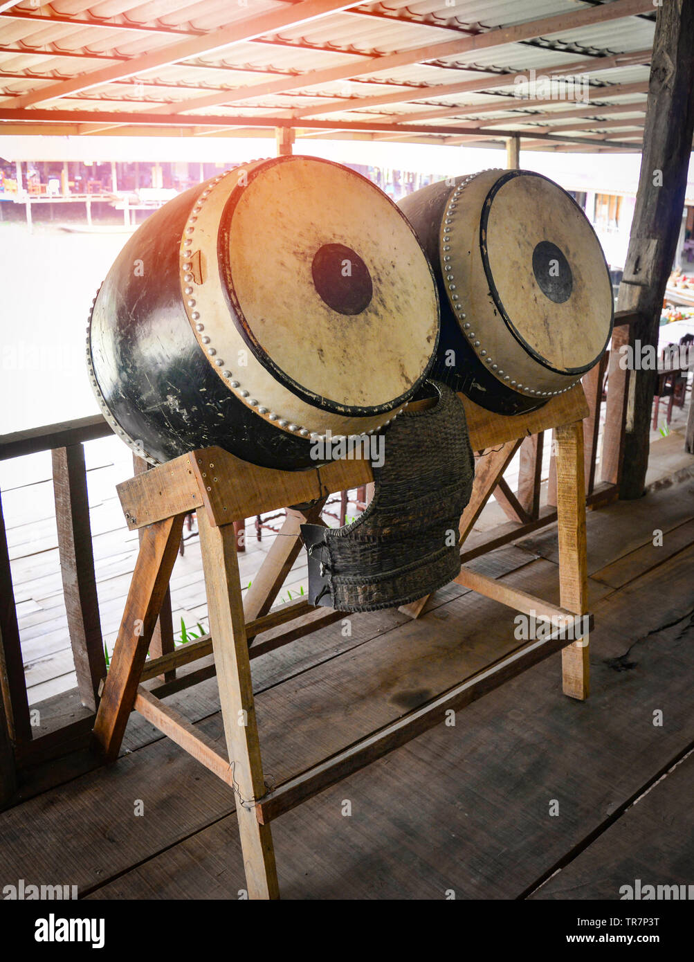 Chinese large drum on wood shelves made buffalo skin / vintage style decoration or for buddhist in temple Stock Photo - Alamy