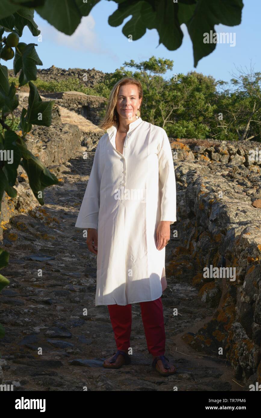 Italy, Sicily, Island of Pantelleria : The french actress Carole Bouquet pictured in Contrada Serraglio where she produces Sangue d'Oro, Passito of Pa Stock Photo