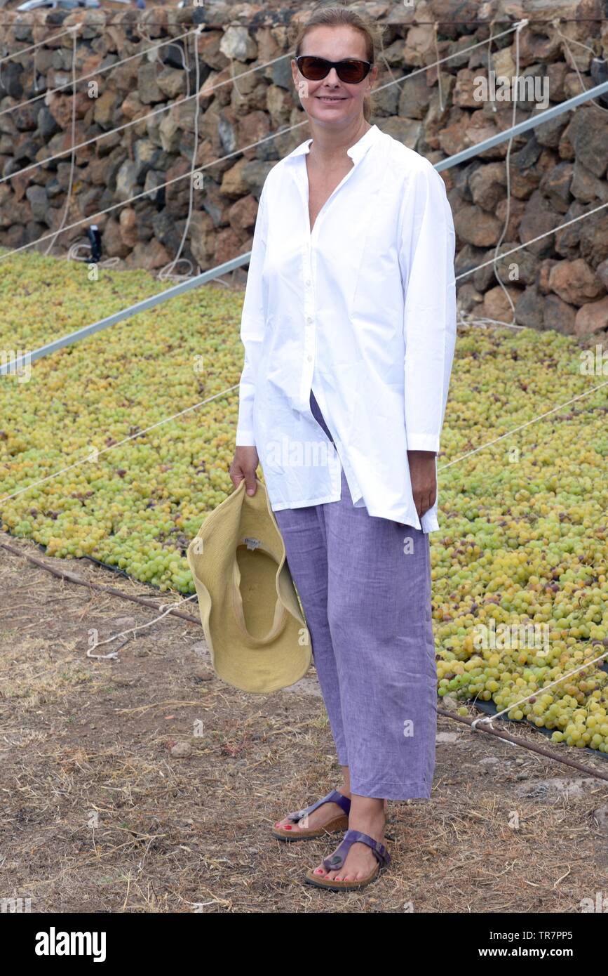 Italy, Sicily, Island of Pantelleria : The french actress Carole Bouquet pictured in Contrada Serraglio where she produces Sangue d'Oro, Passito of Pa Stock Photo