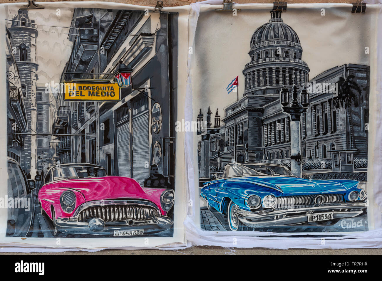 Paintings of classic american cars for sale on a pavement in Habana Vieja (Old Town) Havana, Cuba, Caribbean Stock Photo