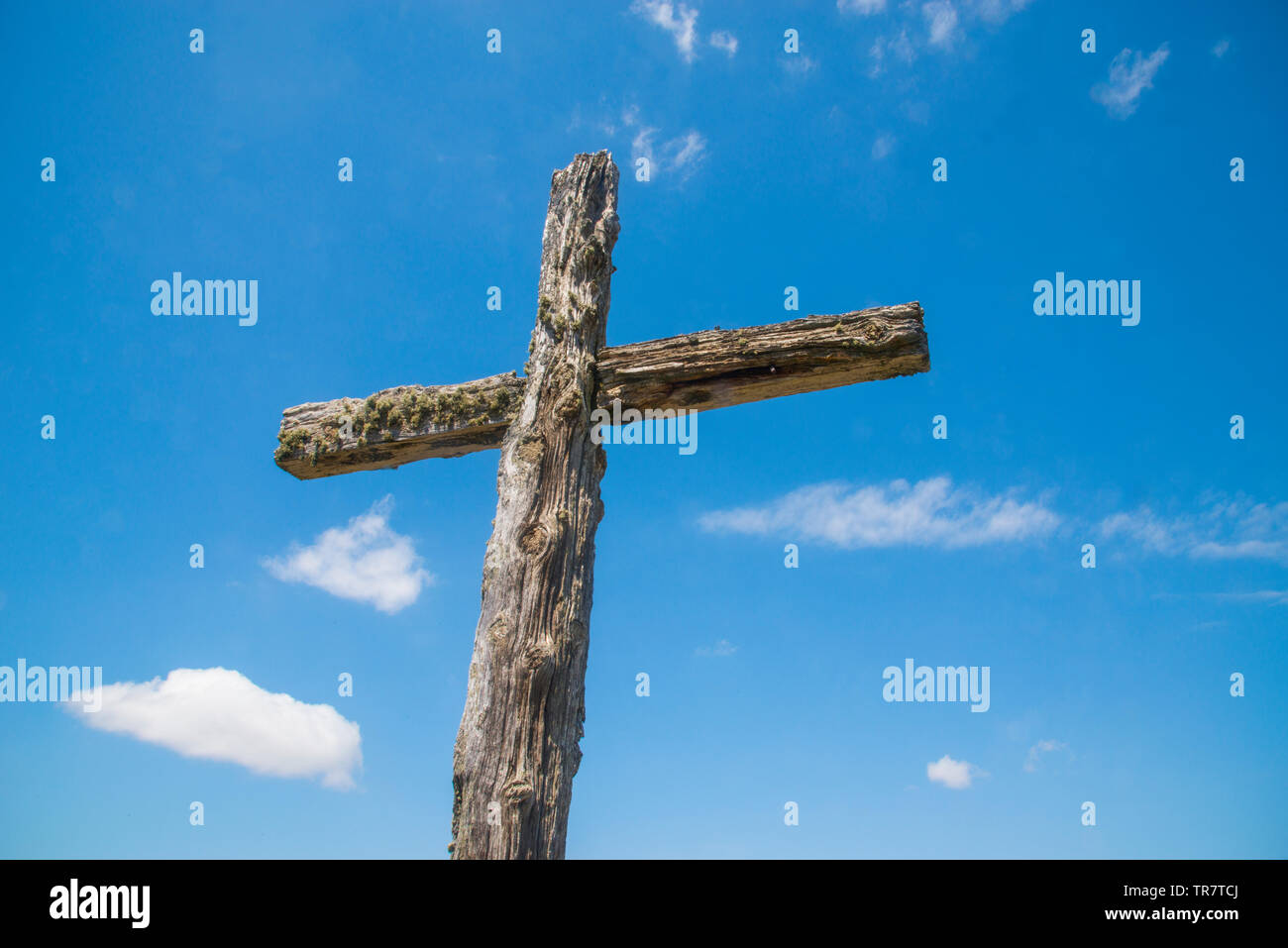 Wooden cross against blue sky. Stock Photo