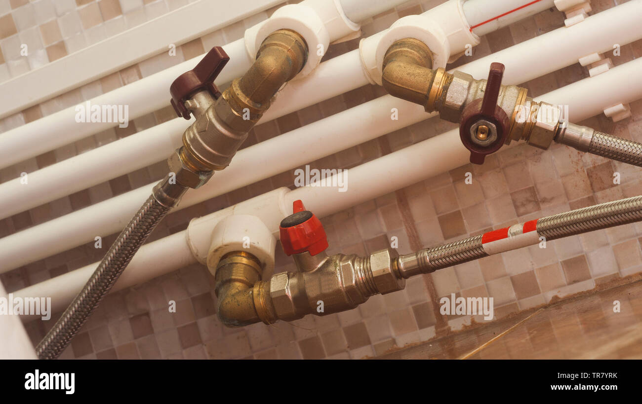 many pipes for water tap in the bathroom Stock Photo Alamy