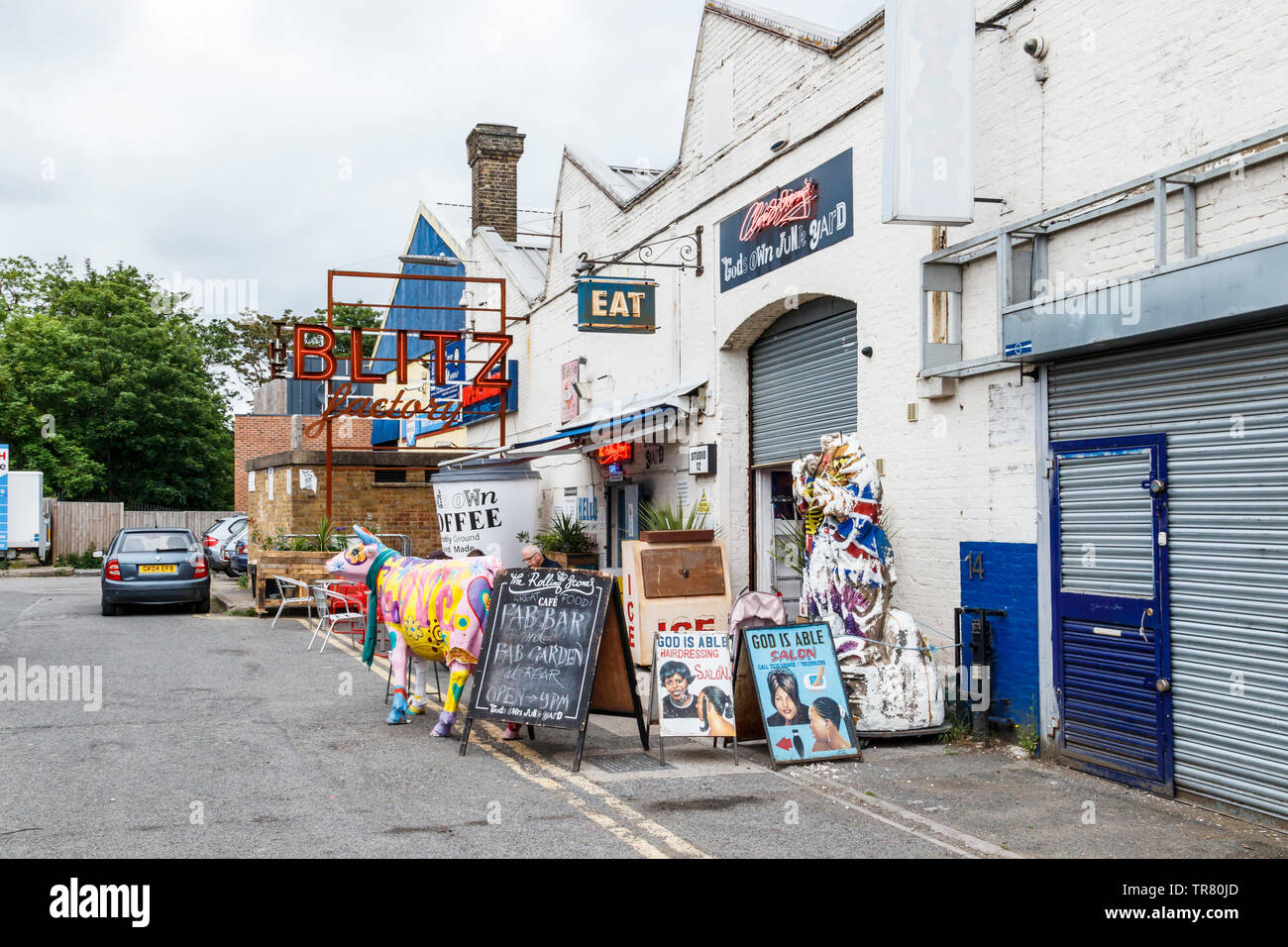 God's Own Junk Yard art store and cafe, featuring neon and lightbulb signs and other eclectic pieces, in Ravenswood Industrial Estate, Walthamstow, UK Stock Photo