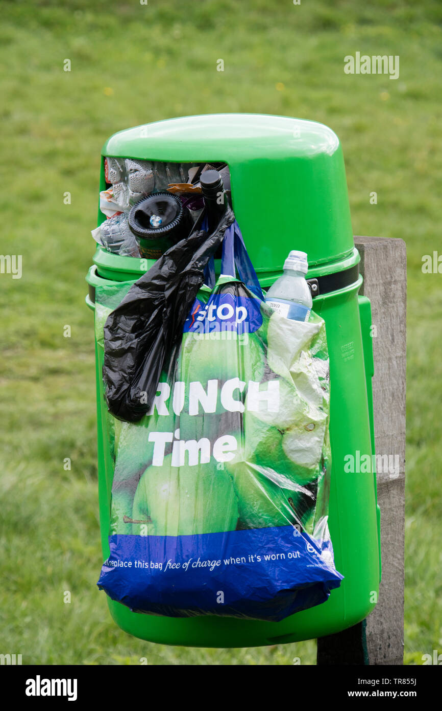 Overflowing litter bins in the countryside, England UK Stock Photo
