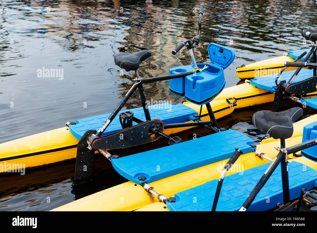 Bicycles on Kayak like floating pontoons for tourists to ride in the river in Tampa Bay Florida. Stock Photo