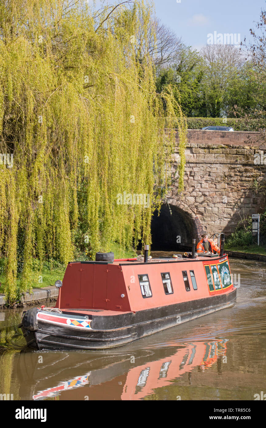 Boating on the Worcester and Birmingham Canal exiting Tardebigge tunnel, Worcestershire, England, UK Stock Photo