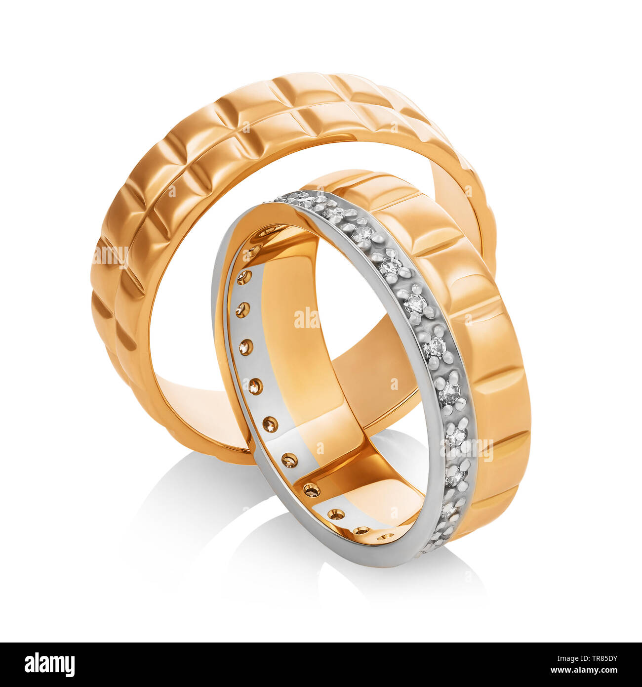 Beautiful pair of gold wedding rings with diamonds isolated on white ...