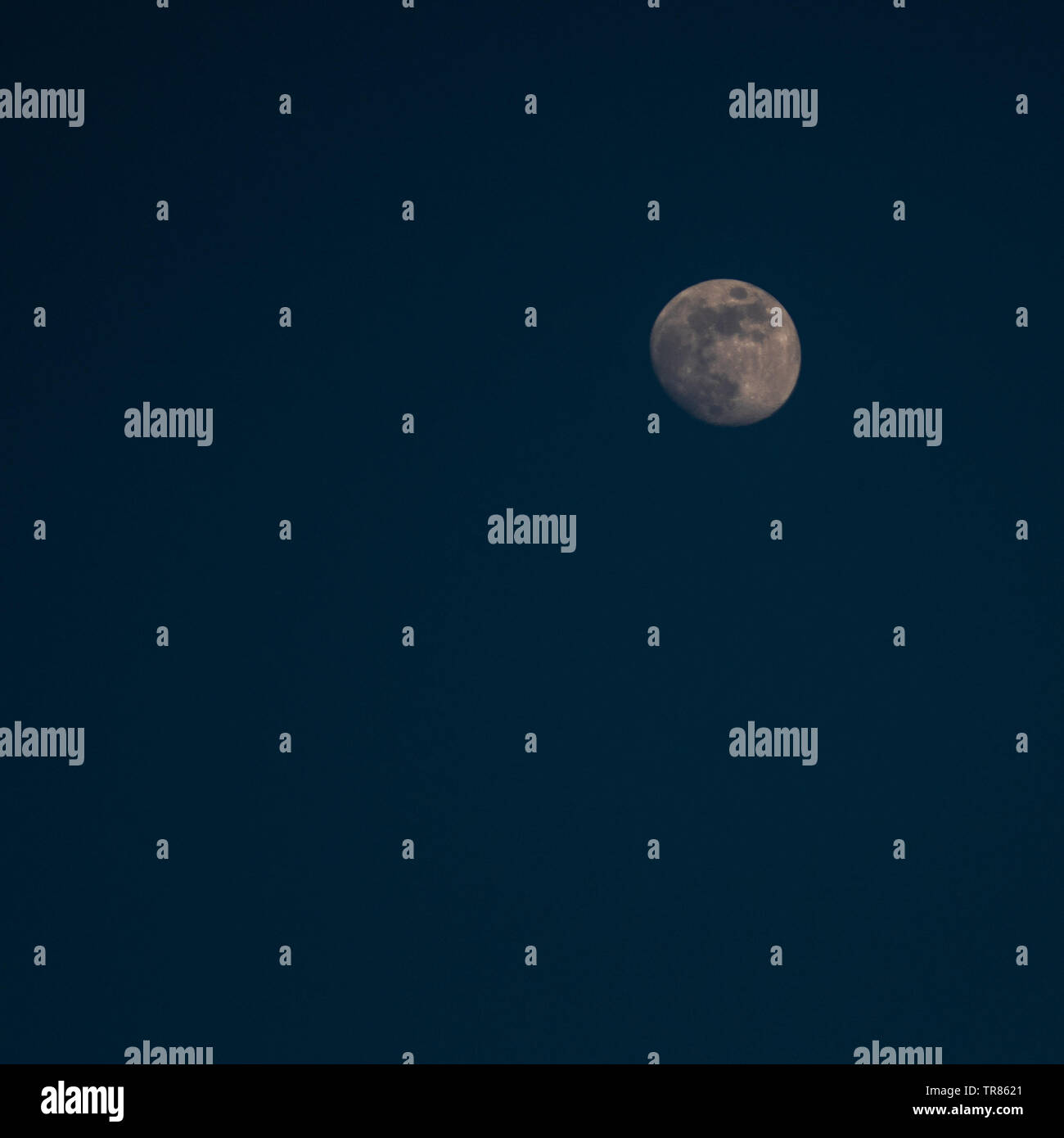 Three quarters moon in a Night Sky Stock Photo Alamy