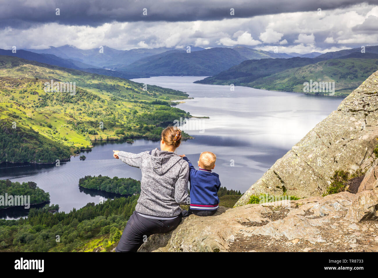 Mom and boy watching Loch Katrine, Trossachs National Park, Scotland Stock Photo