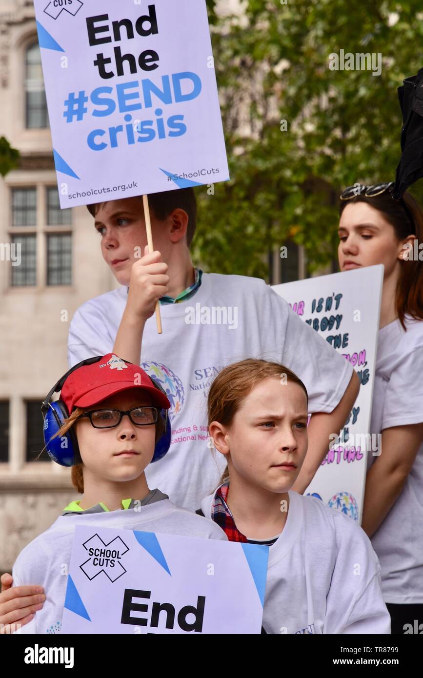 Hundreds of parents, carers, children and young people with disabilities demonstrated in Parliament Square to highlight a funding crisis in Special Needs and Disabilities (SEND). Parliament Square, London Stock Photo