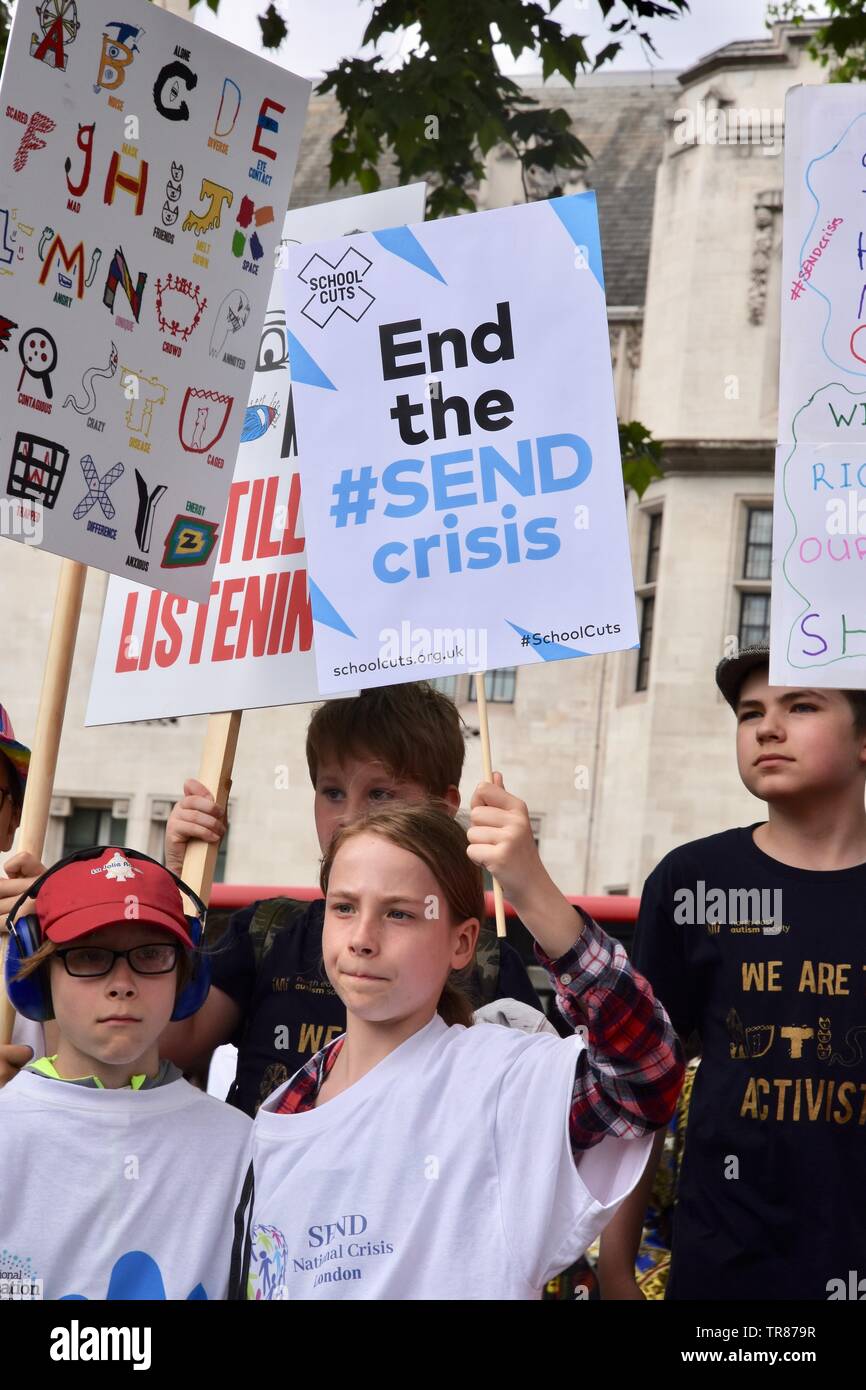Hundreds of parents, carers, children and young people with disabilities demonstrated in Parliament Square to highlight a funding crisis in Special Needs and Disabilities (SEND). Parliament Square, London. UK Stock Photo