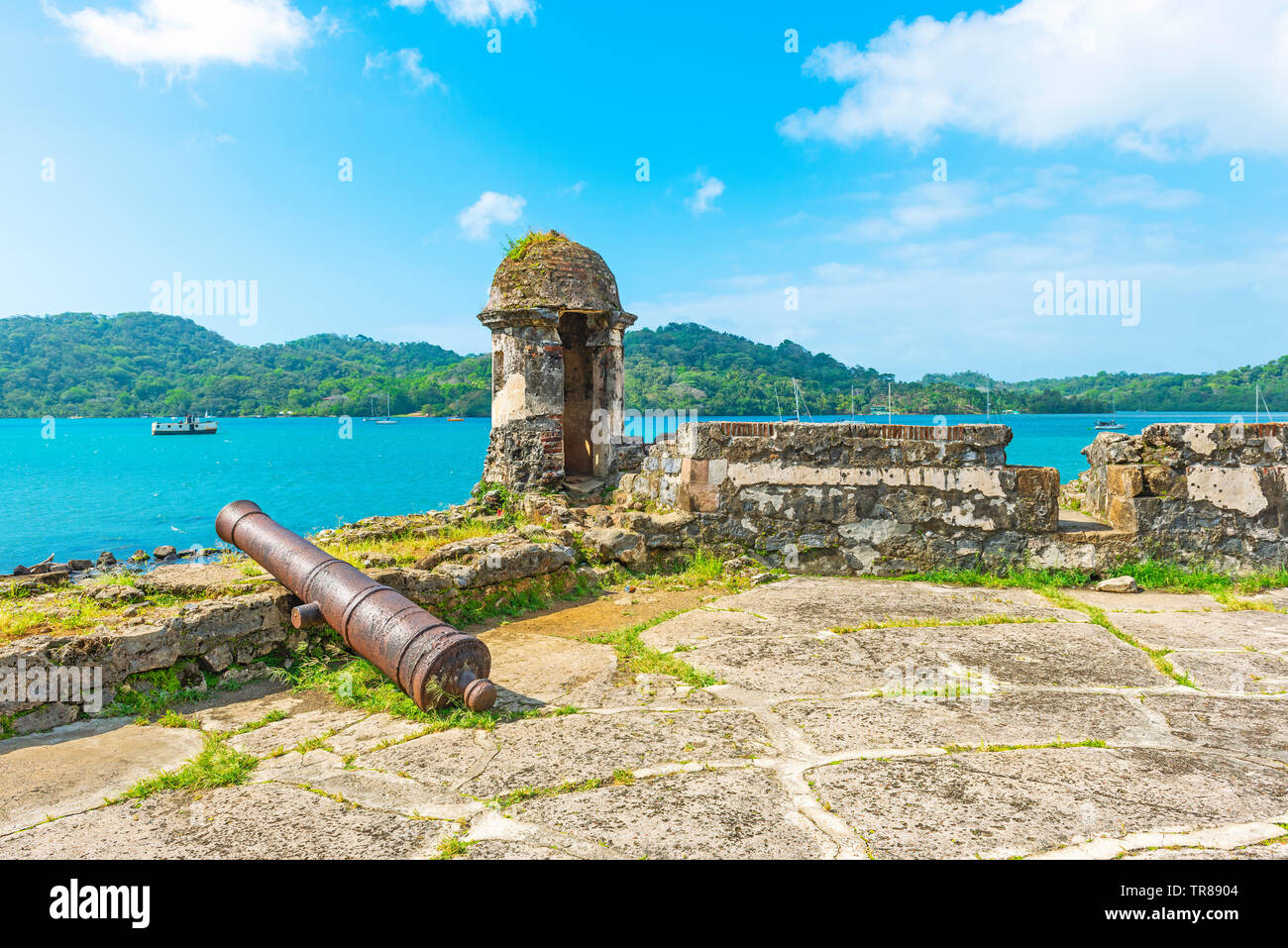 Ancient Spanish fortress with shooting tower and cannon by the Caribbean Sea to protect the custom from pirate attacks, Portobelo, Panama. Stock Photo
