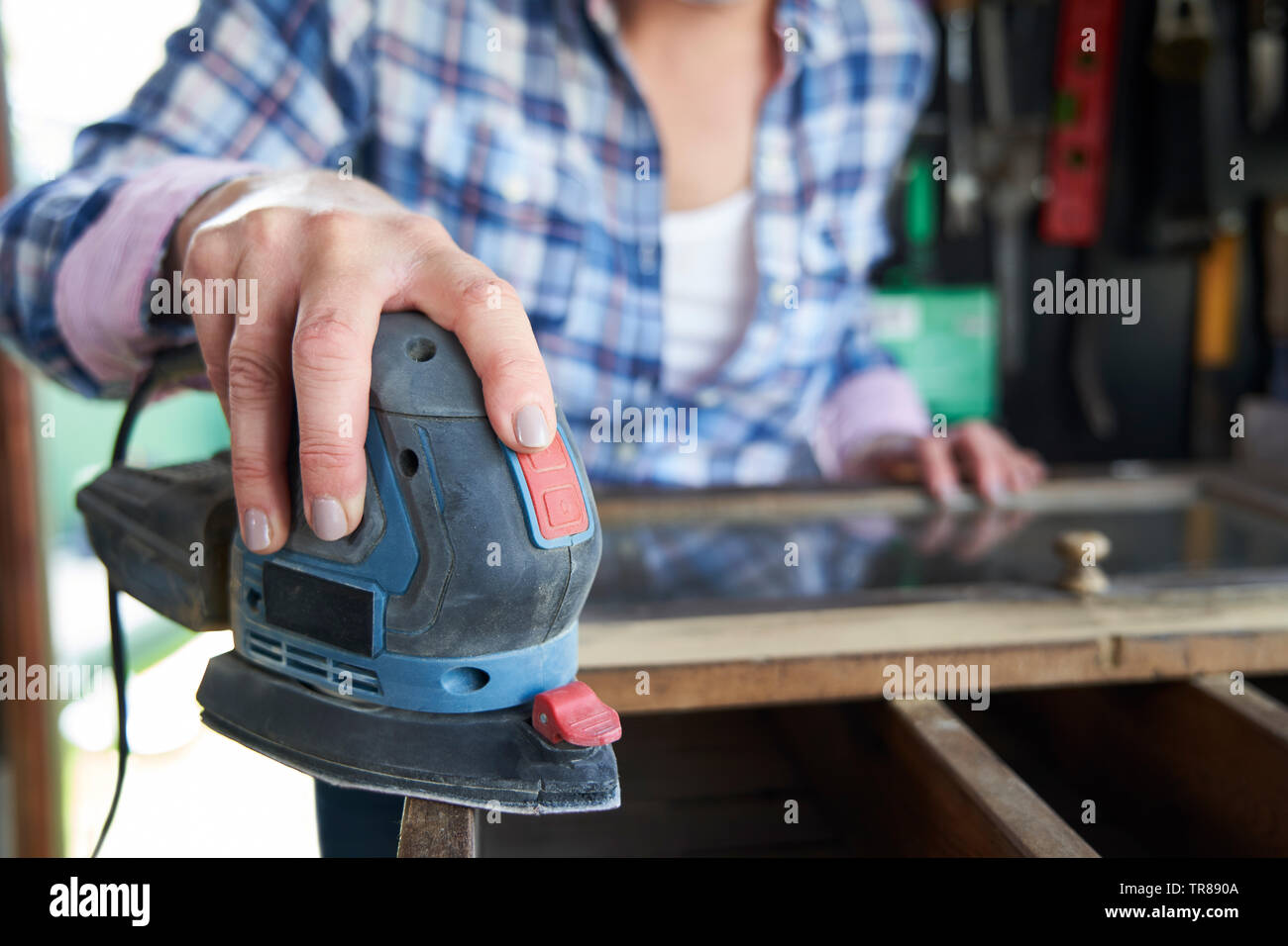 Close Up Mature Woman Upcycling Furniture In At Home Using