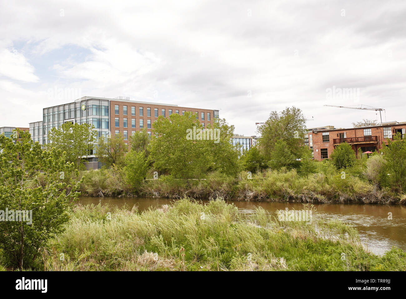Condos and highrise buildings near Platte River at Confluence Park in